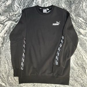 Black Puma sweatshirt with logo strips on sleeves.